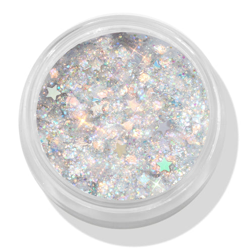 Ur A Firework ColourPop Glitter Gel sparkles with holographic silver micro-glitter and pastel star confetti, filling a clear round jar; top-down close-up shows the iridescent gel’s multidimensional shine on a white background.