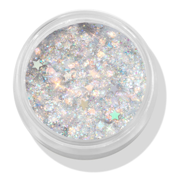 Ur A Firework ColourPop Glitter Gel sparkles with holographic silver micro-glitter and pastel star confetti, filling a clear round jar; top-down close-up shows the iridescent gel’s multidimensional shine on a white background.