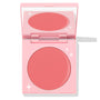 Whole Mood cream blush compact half-open, showing a round rosy-pink matte pan and mirror inside a pastel pink case with white star accents; ColourPop Cream Blush product.