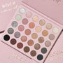 Rock Candy ColourPop Shadow Palette opens to a 30-pan 6x5 grid, showcasing matte, shimmer, and glitter neutrals and pinks - ivory, champagne, rose, taupe, copper, silver, charcoal, and black - set on blush-pink, gold-foil Rock Candy packaging.