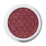 ColourPop Drift Super Shock Shadow displays a metallic cranberry-burgundy shimmer, pressed with a quilted scale pattern, sitting in a round white pot on a plain white studio background.