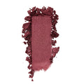 ColourPop Drift Super Shock Shadow swatch, a metallic cranberry-burgundy eyeshadow, smeared in a rectangular stroke with crumbled edges on a white background to showcase its shimmery, high-pigment finish.