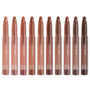 ColourPop Lippie Stix line up showing In the Nude collection - ten twist-up lipsticks in clear tubes, ranging from peach and pinky beige to warm caramel and deep brown - standing upright on a white background.