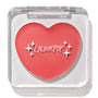 Heart-shaped ColourPop Lip and Cheek Balm in It’s a Look resting in a clear square compact with lid closed, showcasing a warm coral-pink shade and white ColourPop logo on a clean white background.