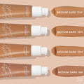ColourPop Pretty Fresh Tinted Moisturizer, shade Medium Dark 14W, swatched alongside Medium Dark 13W, 15W, and 16N; four tan pump bottles line up horizontally with creamy swipes on a beige background.