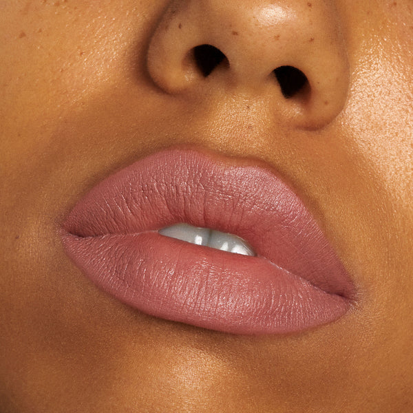 Lips wearing ColourPop Lippie Pencil in Oh Snap, a rosy nude pink, lining and filling the mouth with a soft matte finish and crisp edges in a close-up beauty shot.