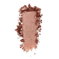 ColourPop Sequin Super Shock Shadow swatch streaking across white background, a warm rose-gold copper eyeshadow with fine glitter, richly pigmented and slightly crumbled along the edges.
