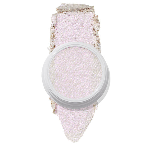 ColourPop Spellbound Super Shock Highlighter in a white pot, displaying an iridescent pink-lilac glow, with a broad swatch stroke beneath the pan showing its soft, shimmery payoff on a clean white background.