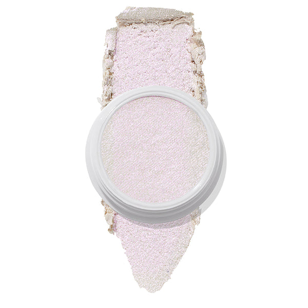 ColourPop Spellbound Super Shock Highlighter in a white pot, displaying an iridescent pink-lilac glow, with a broad swatch stroke beneath the pan showing its soft, shimmery payoff on a clean white background.