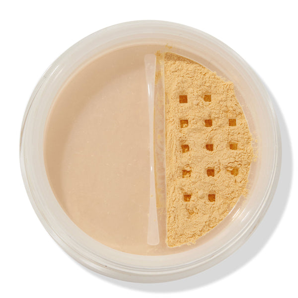 ColourPop No Filter Loose Setting Powder in Banana shown open, yellow-toned powder visible through a square-holed sifter in a clear round jar on a white background, used for brightening and setting makeup.
