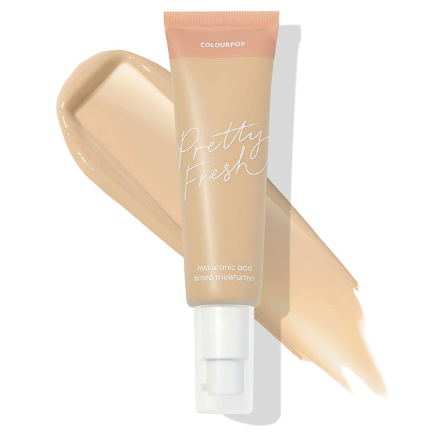 ColourPop Pretty Fresh Tinted Moisturizer Light 6 W angled across a light warm beige swatch, showing peach cap and white pump on a clean white background; hyaluronic acid formula in a soft-matte tube for a natural, skin-tint finish.