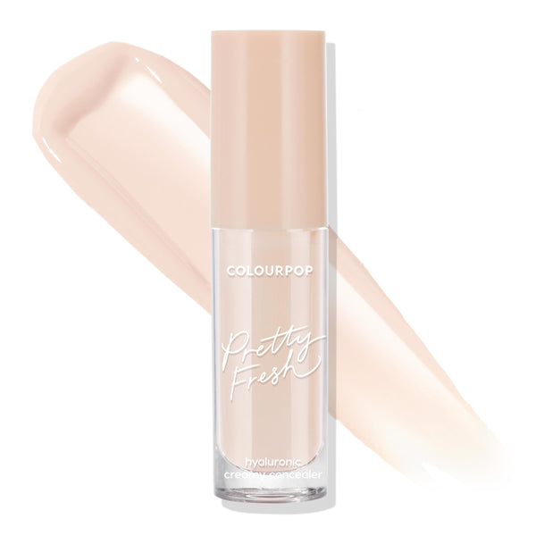 ColourPop Pretty Fresh Creamy Concealer in Fair 20 N standing upright, clear tube with beige cap and white Pretty Fresh logo, with a light neutral swatch behind on white; hydrating hyaluronic formula for brightening, buildable coverage.