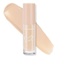 ColourPop Pretty Fresh Creamy Concealer in Light 45 W stands upright in a clear tube with a blush cap, showing its hyaluronic formula as a wide peach‑beige swatch sweeps behind on a white background, emphasizing the light warm shade.