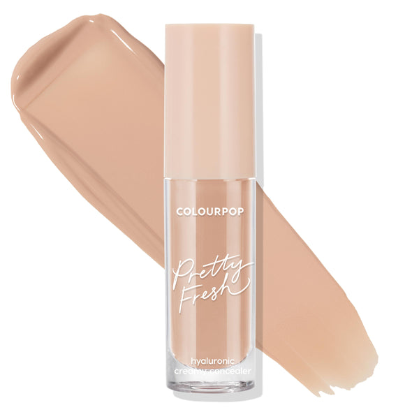 ColourPop Pretty Fresh Creamy Concealer in Medium Dark 125 N stands upright in a clear tube with a beige cap as smooth tan swatches arc behind on white, highlighting the hyaluronic, neutral medium‑dark shade.