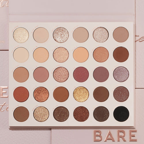 Bare Necessities ColourPop Shadow Palette showcasing 30 neutral matte and shimmer shades in a 6x5 grid - ivory, taupe, mauve, bronze, gold, deep brown, and black - laying open on blush-pink packaging with BARE lettering, ideal for everyday looks.