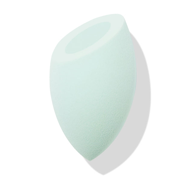 Mint green Silicone Blending Sponge dabs foundation and concealer, featuring a teardrop body with pointed tip and flat top with circular well, shown angled on a white backdrop with soft shadow; ColourPop Makeup Tools & Accessories.