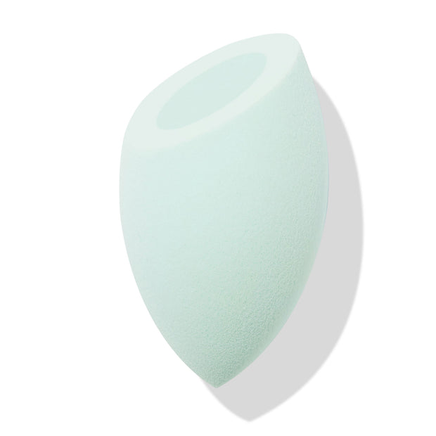 Mint green Silicone Blending Sponge dabs foundation and concealer, featuring a teardrop body with pointed tip and flat top with circular well, shown angled on a white backdrop with soft shadow; ColourPop Makeup Tools & Accessories.