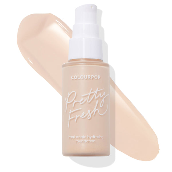 ColourPop Hyaluronic Hydrating Foundation (Pretty Fresh) in shade Fair 10 N stands upright in a frosted bottle with a white pump, with a creamy neutral swatch swept behind on a white background to show tone and coverage.