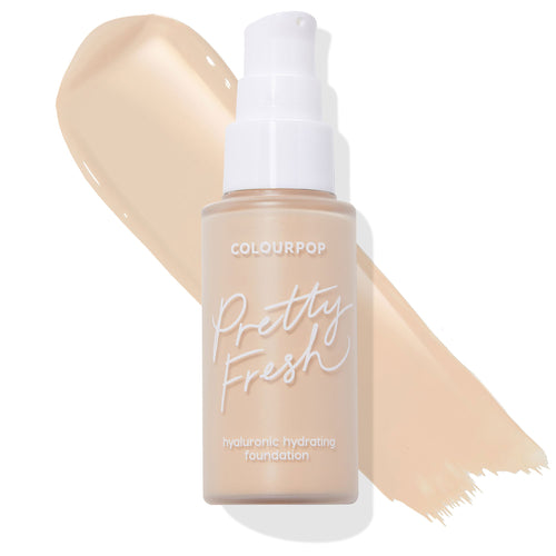 ColourPop Pretty Fresh Hyaluronic Hydrating Foundation bottle in shade Fair 15 W stands upright with a white pump and frosted finish, set over a creamy fair‑beige swatch on white; ColourPop Hyaluronic Hydrating Foundation.