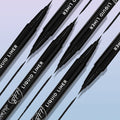 ColourPop BFF Liquid Liner in Black, brush-tip pen drawing sleek, ultra-pigmented lines, with multiple pens angled diagonally and inky strokes on a soft gradient background - ideal for precise wings and long-wear eyeliner looks.