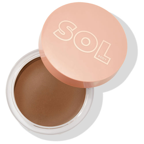 Open jar displaying the creamy ColourPop SOL Face & Body Bronzing Balm in Deep, a warm deep-brown shade, with a clear tub and peach SOL Body lid partially off, set on a clean white background for a studio product shot.