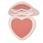 ColourPop Kiss 'N Tell pressed powder blush compact, open to reveal a peachy-rose heart-shaped pan and heart mirror, in pale pink packaging on a white background.