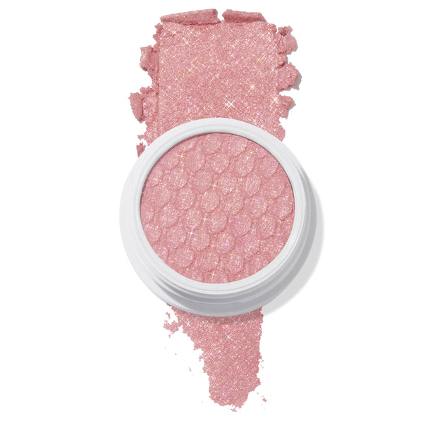 ColourPop Sweet Tea Super Shock Shadow showcases a sparkly rose-pink shade, the bouncy dimpled pan in a white pot with a swipe of pigment revealing a metallic, glitter finish against a clean white background.