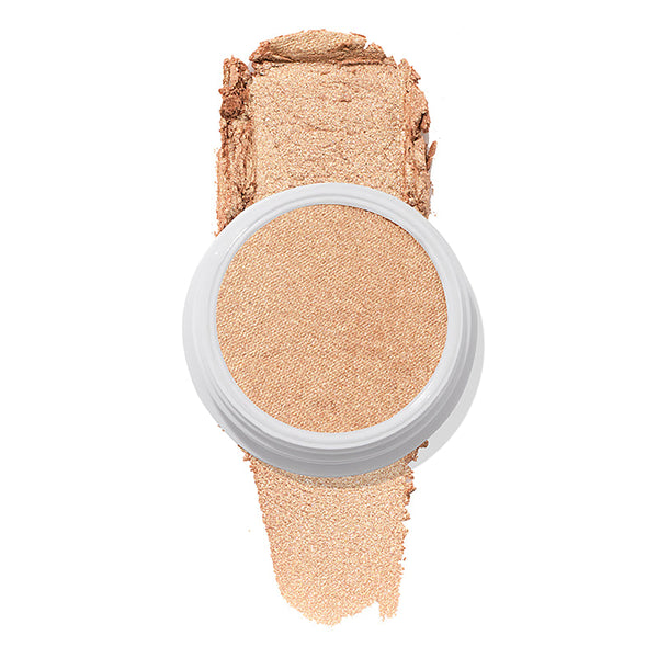 Flute Punch, a ColourPop Super Shock Highlighter, sits in a white round pot while sweeping a swatch of warm champagne-gold shimmer beneath it on a clean white background.