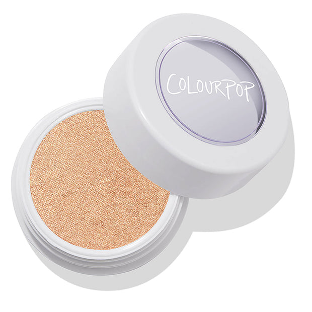 Flute Punch ColourPop Super Shock Highlighter sits open, revealing a creamy bouncy pan of warm champagne‑gold shimmer in a white round pot with a clear lid and ColourPop logo, photographed on a clean white background.
