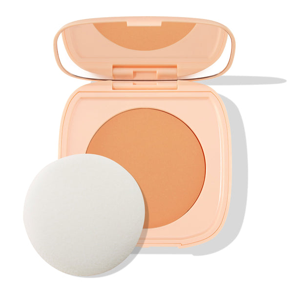 ColourPop Pretty Fresh Face Powder in Medium 10 shown open, warm medium pressed powder in a peach compact with built-in mirror, accompanied by a round white applicator puff on a clean white background.