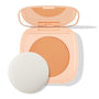 ColourPop Pretty Fresh Face Powder in Medium 10 shown open, warm medium pressed powder in a peach compact with built-in mirror, accompanied by a round white applicator puff on a clean white background.