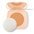 ColourPop Pretty Fresh Face Powder in Medium 12 sits open, revealing a medium-tan pressed powder pan and mirror in a peach compact, with a white round applicator sponge beside it on a clean white background.