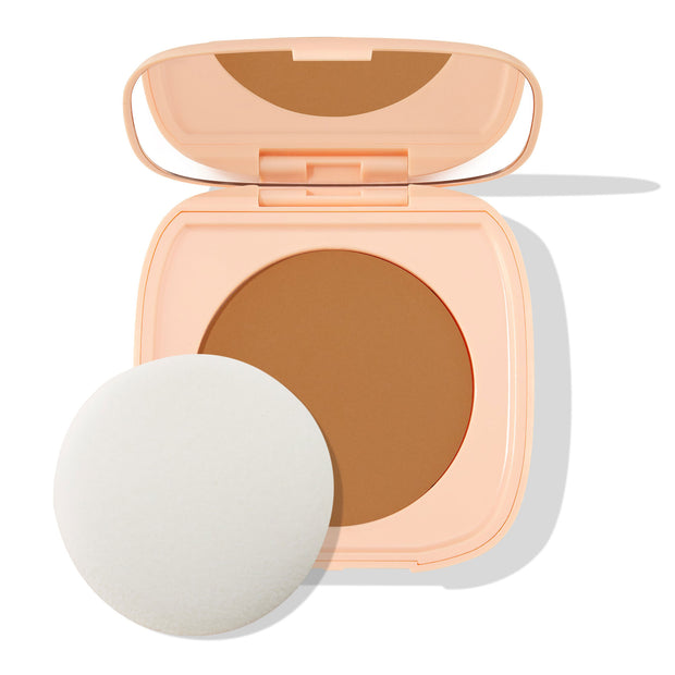 Open peach compact displays ColourPop Pretty Fresh Face Powder in Dark 18, a pressed powder pan with built-in mirror and round applicator sponge on a white background.