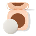 Open peach square compact displays the Deep Dark 21 shade - a rich deep-brown pressed pan - with a built-in mirror and round white puff beside it on a white backdrop; ColourPop Pretty Fresh Face Powder.
