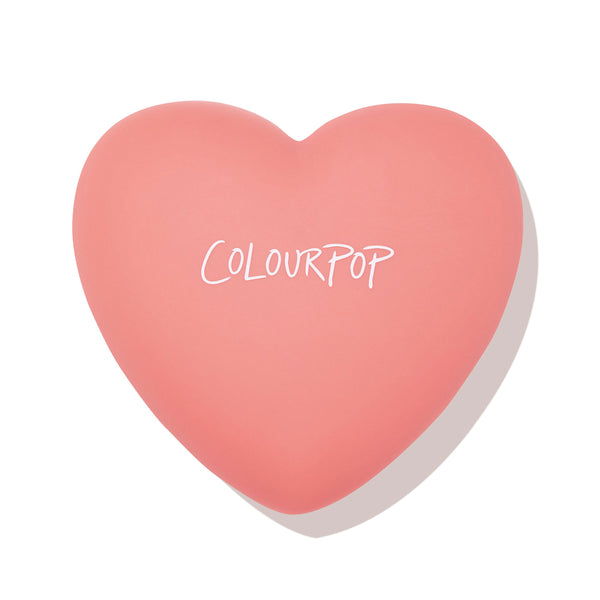 Heart-shaped coral compact with ColourPop logo, presenting Let’s Dance, a ColourPop Pressed Powder Blush, closed and centered on a white background.