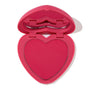 Heart-shaped Text Me pressed powder blush in a bright pink compact, opened to show the vibrant fuchsia pan and lip-shaped mirror, ColourPop Pressed Powder Blush for cheeks displayed on a white background.