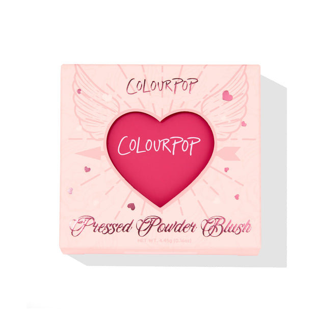 ColourPop Pressed Powder Blush in Text Me showcased in a blush‑pink compact, heart‑shaped window revealing a vibrant fuchsia pan, wing and heart graphics on the box, 4.45 g/0.16 oz, set on a white background.