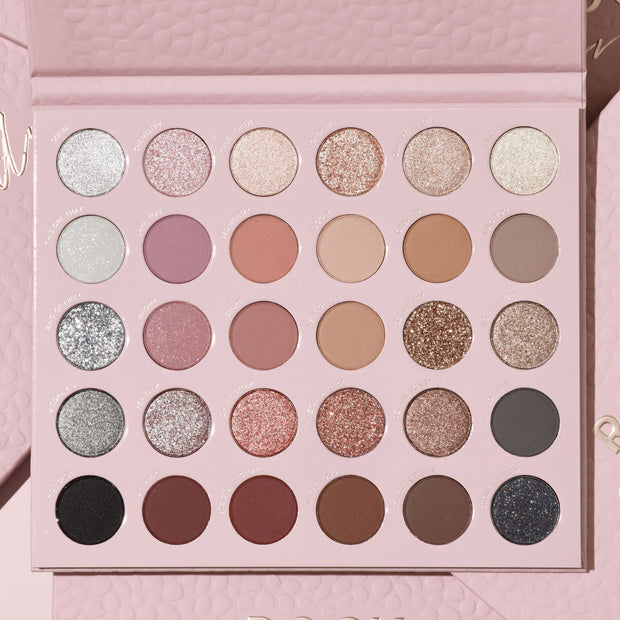 Rock Candy ColourPop Shadow Palette sits open, showing 30 round pans arranged in a 5x6 grid of neutral-to-rosy mattes and sparkling metallics - silvers, champagnes, pinks, taupes, tans, bronzes, charcoal, and black - in a blush pink textured case.