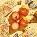 Hunny Pot Lip Care Kit by ColourPop displayed top-down: two honey-pot jars labeled “HUNNY,” open balm and sugar lip scrub with mini honey dippers, Winnie the Pooh themed packaging, bee and monarch butterflies on a yellow background.