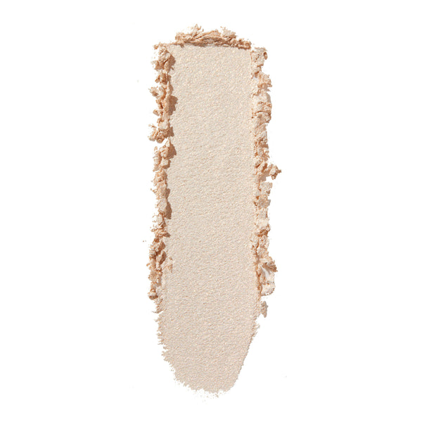 ColourPop 3rd St Super Shock Shadow swatch streaking vertically, a shimmery pale champagne‑beige eyeshadow with soft metallic sheen on a white background, highlighting texture, color payoff, and blendability.