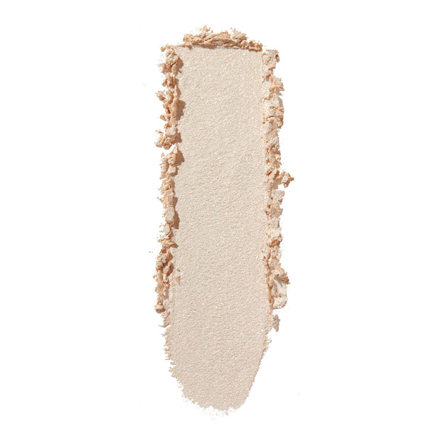ColourPop 3rd St Super Shock Shadow swatch streaking vertically, a shimmery pale champagne‑beige eyeshadow with soft metallic sheen on a white background, highlighting texture, color payoff, and blendability.