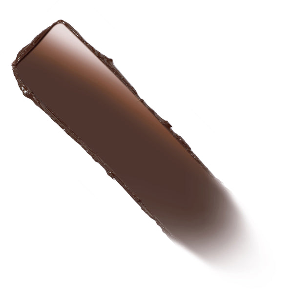 Deep chocolate-brown ColourPop Lippie Stix swatch - Oh, Behave - glides in a smooth, creamy swipe with a subtle sheen, shown diagonally on a clean white background.