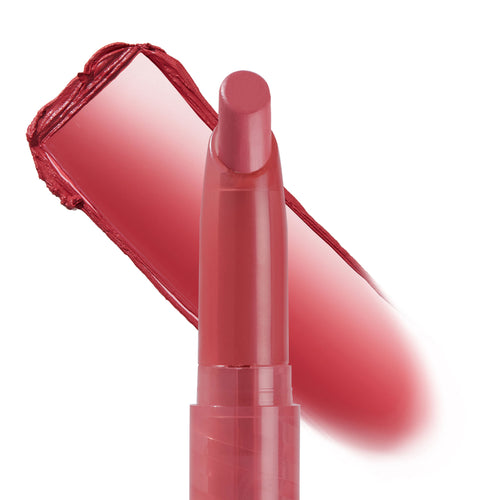 After Shock Lippie Stix applying a creamy warm-rose swipe, the slim twist-up bullet stands upright with a matching smear behind it on a white background; ColourPop Lippie Stix lipstick highlights rich pigment and a sleek pink tube.