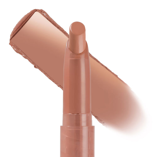 ColourPop Lippie Stix Dream Date glides a creamy warm nude swatch across a white background, the slim twist-up lipstick standing upright with a rounded tip, showcasing the beige-peach shade and smooth texture for everyday wear.