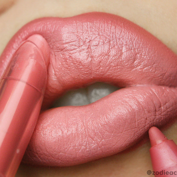 Starship Lippie Pencil lining and filling close-up lips in a creamy coral-pink, highlighting smooth, satin finish and crisp edges; ColourPop Lippie Pencil offers precise definition for a bold, everyday look.