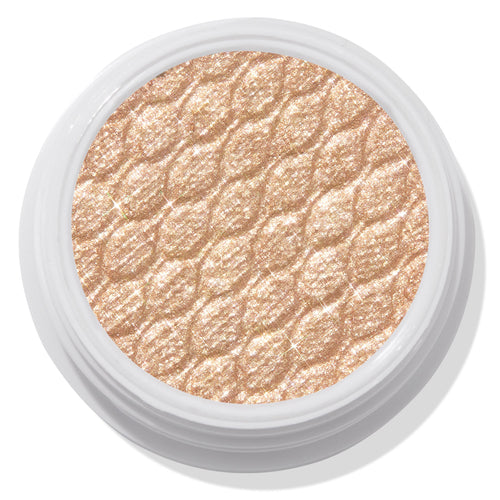 ColourPop Super Shock Shadow Flower Child displaying a shimmery champagne-gold eyeshadow pan with a quilted sparkle texture, set in a white round pot on a light backdrop.