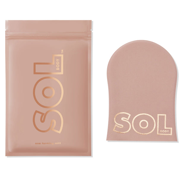 Tanning Mitt showcases a blush-pink, velvety SOL Body applicator lying flat beside its matching resealable pouch on a white background, gold logo visible, for streak-free self-tanner application from ColourPop Makeup Tools & Accessories.
