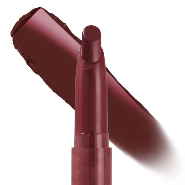 Hot in Here ColourPop Lippie Stix gliding in a single swatch, showcasing a deep brick-red, creamy matte finish; twist-up bullet angled for application on a clean white background, highlighting smooth, full-coverage lipstick color.