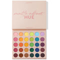 ColourPop Shadow Palette Matte About Hue shown open, displaying 30 all-matte pressed powder shades in a rainbow gradient - pinks, oranges, yellows, greens, blues, purples, and browns - arranged in rows, lid reading “matte about HUE” on a white backdrop.