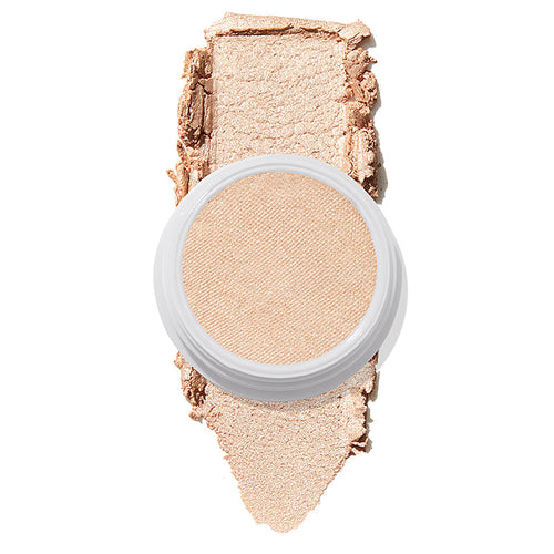 ColourPop Super Shock Highlighter in Lunch Money displaying a creamy champagne‑pearl pan atop a thick swatch of luminous shimmer on white, emphasizing its soft, buildable glow for face and cheek highlighting.